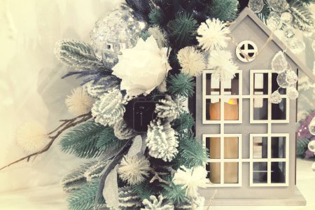 Photo for Decorative New Year's candlestick in the shape of a house with Christmas tree decorations - Royalty Free Image
