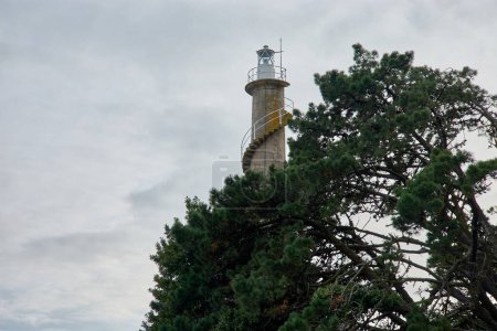 Tenlo Chico Lighthouse, on Tambo Island, property of the Marin Military Naval School (Galicia, Spain). The lighthouse has a 20-meter-high masonry tower, inaugurated in 1922.