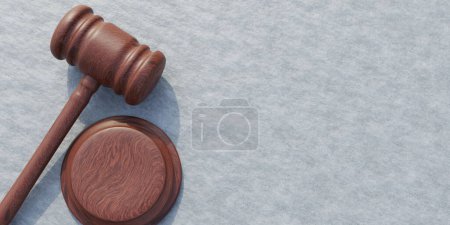 Wooden judge gavel on grey concrete wall background. Brown hammer, auction or judgment symbol, punishment or agreement. Above view, space. 3d render
