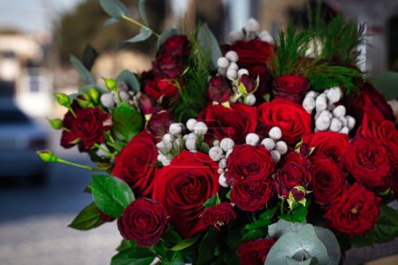 A stunning arrangement of red roses in a vase, perfect for any occasion.