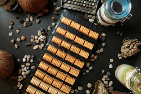 Photo for A table filled with an abundant assortment of crackers and nuts, creating a mouthwatering display. - Royalty Free Image