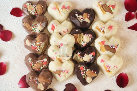 A collection of heart-shaped chocolates neatly displayed on a tabletop.