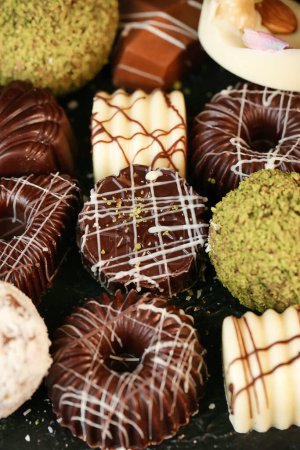 A detailed view showcasing various types of doughnuts with different flavors and styles.