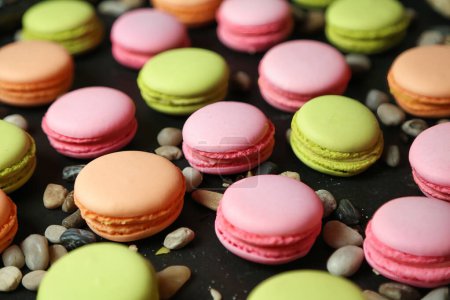 A vibrant assortment of macaroons featuring various colors and flavors, captured in a detailed close-up shot.