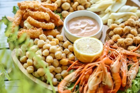 Photo for A platter featuring a variety of shrimp and other delectable dishes. - Royalty Free Image