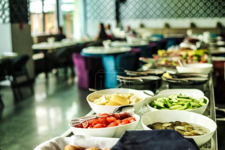 A buffet line filled with a wide variety of delicious food items, ready to be enjoyed.