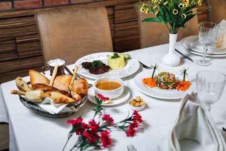 A table topped with delectable dishes and servings of food, arranged to be visually appealing.