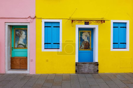 Photo for A striking yellow house, very famous indeed, at Burano an island of the Venice lagoon with a small fisher village plenty of colorful painted houses. - Royalty Free Image