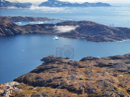 Photo for Aerial view of tasiilaq fjord of greenland, mountains and fog - Royalty Free Image
