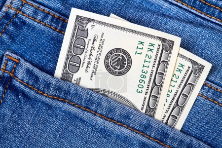 Hundred dollar bills in jeans pocket