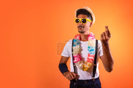 Photo for Carnival Brazilian Outfit. Black Man With Carnival Costume Having Fun,  Isolated on Orange Background - Royalty Free Image