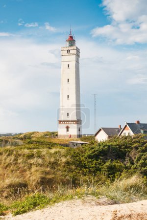 Lighthouse in the sand dunes on the beach of Blavand, Jutland Denmark Europe
