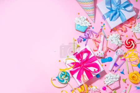 Photo for Happy birthday greeting card background. Flatlay with colorful holiday tools - birthday party caps, blowers, gift boxes , balloons, steamers, candles, on pink background copy space - Royalty Free Image