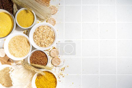 Photo for Selection of whole grains gluten free cereals. Set of various non-gluten cereals: rice, buckwheat, corn groats, quinoa, millet, oats, buckwheat, bulgur, porridge, barley, white background copy space - Royalty Free Image