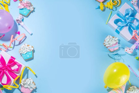 Photo for Happy birthday greeting card background. Flatlay with colorful holiday tools - birthday party caps, blowers, gift boxes , balloons, steamers, candles, on blue background copy space - Royalty Free Image