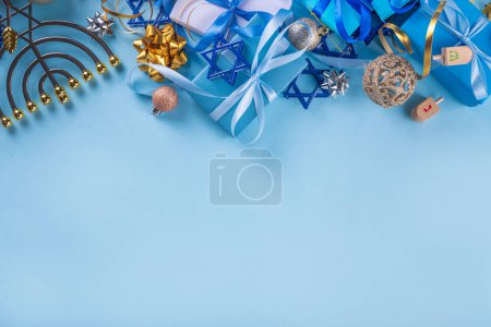 Photo for Happy Hanukkah greeting card background. Jewish New Year holiday flat lay with traditional symbols of hanukkah festival, menorah, donuts and decorations copy space - Royalty Free Image