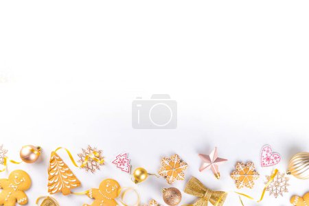 Photo for Christmas Gingerbread cookie background. Various festive biscuits - Gingerbread man, snowflakes, Christmas tree - with Xmas, New Year, Noel golden decoration on light colored background top view - Royalty Free Image