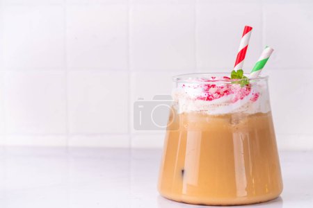 Photo for Iced Peppermint Mocha or Latte, Christmas coffee drink with crushed candy canes, whipped cream and mint syrup, festive holiday cold drink - Royalty Free Image