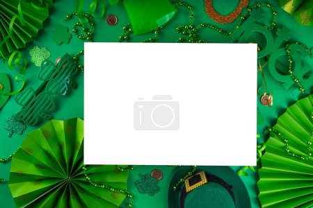 Photo for Shamrock saint patrick's day background, St. Patrick's holiday flat lay with party accessories, decor, golden coins, leprechaun's hat, eyeglasses, lucky horseshoe, confetti, beads on green background - Royalty Free Image