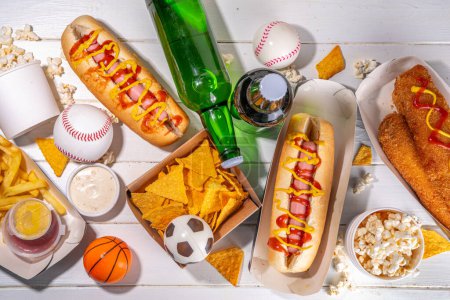 Photo for Traditional sport stadium foods and beer background, Set of various baseball, basketball, football fans and stadium snacks, chips, sauces, hot dogs with beer bottles and fan accessories - Royalty Free Image