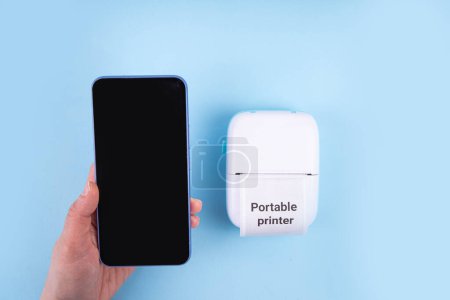 Portable Photo Printer, Mobile thermal pocket printer printer device with laptop, smartphone, mobile gadgets and thermal Paper Roll with Portable Printer text on it