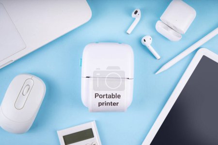 Portable Photo Printer, Mobile thermal pocket printer printer device with laptop, smartphone, mobile gadgets and thermal Paper Roll with Portable Printer text on it