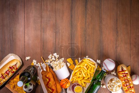 Photo for Traditional sport stadium foods and beer background, Set of various baseball, basketball, football fans and stadium snacks, chips, sauces, hot dogs with beer bottles and fan accessories - Royalty Free Image