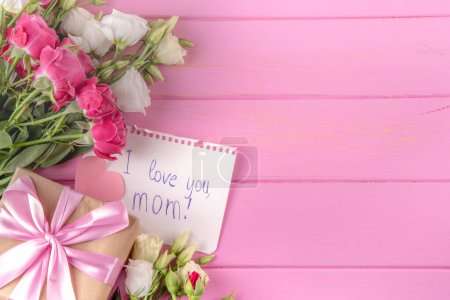 Photo for Mother's day international holiday greeting card, Bouquet of rose flowers, cute postcard notes Best Mom Forever in the shape of hearts, on a pink pastel background flat lay top view copy space - Royalty Free Image
