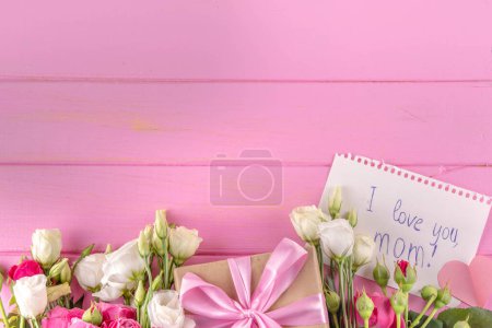 Photo for Mother's day international holiday greeting card, Bouquet of rose flowers, cute postcard notes Best Mom Forever in the shape of hearts, on a pink pastel background flat lay top view copy space - Royalty Free Image