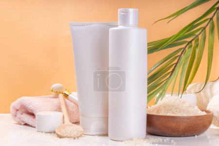 Rice Shampoo and Conditioner, organic rice water hair care. Natural beauty, organic fermented cosmetics with rice grains on background copy space