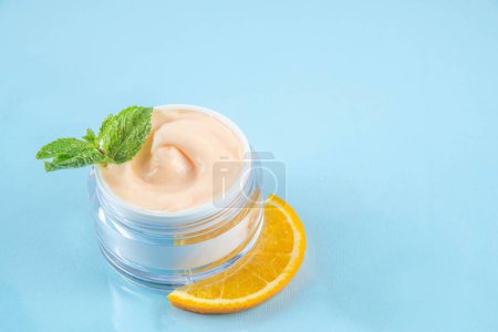 Orange citrus Vitamin C face care - cream, serum. mask, face cleaner, antioxidant moisturizer skin face care and make up concept, with fresh orange fruit slices
