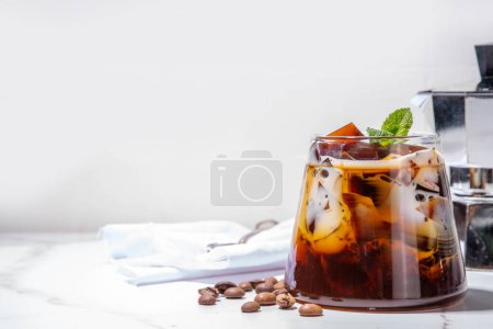 Coffee Jelly Dessert made with strong espresso coffee, gelatin or agar and whipped cream. Asian cold coffee sweets kohii zerii kanten on white table background copy space