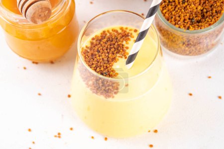 Bee pollen dish, creamy warm or cold shake smoothie golden colored drink