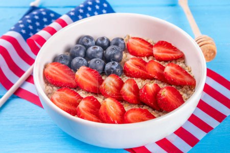 USA patriotic breakfast oatmeal. Simple Independent or American Flag Day idea with oatmeal berry flag decor, Healthy holiday July 4 breakfast