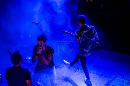 Photo for Rock and roll group performing live at night - Royalty Free Image