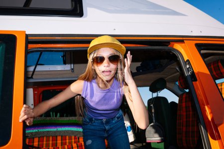 Photo for The happy girl has fun on a wonderful camping day. Van life concept. - Royalty Free Image