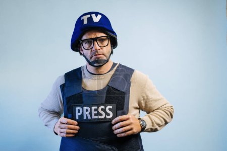 Photo for Reporter with bulletproof vest in the studio. - Royalty Free Image