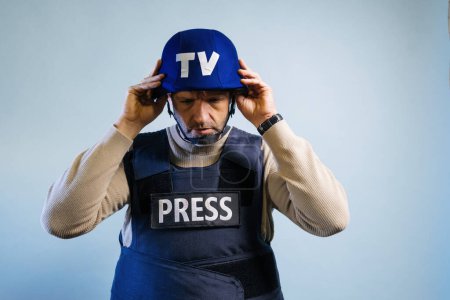Photo for Reporter with bulletproof vest in the studio. - Royalty Free Image
