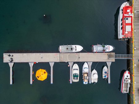 aerial view of boats floating at the pier of village of Hrisey in north Iceland