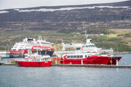 Photo for Akureyri Iceland, May 25. 2023: Modern whale watching safari boats and a cruise ship - Royalty Free Image