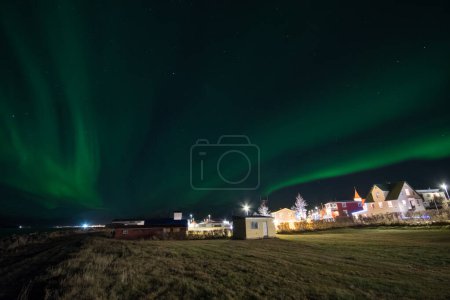 Aurora borealis in village of Hrisey in North Iceland
