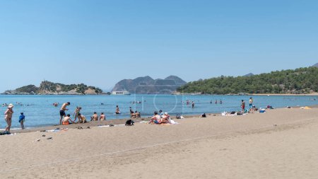 Photo for Iztuzu beach, Mugla - July 2022: Sun loungers on a famous Iztuzu beach, also a nesting ground for loggerhead sea turtles and a protected area, ensuring the preservation of its natural beauty. - Royalty Free Image