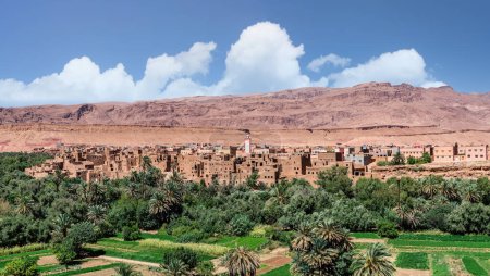 Photo for Tinghir, sometimes known as Tinerhir, is a city in Morocco, nestled in the High Atlas Mountains. It's known for its scenic beauty, with lush green oases and the Todgha Gorge - Royalty Free Image