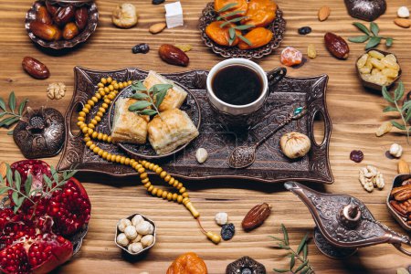 Photo for Ramadan table top view. Banner with traditional Arabic dishes, cup of coffee and food sets - Royalty Free Image