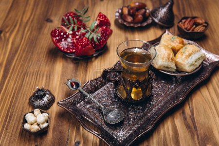 Photo for Ramadan table top view. Banner with traditional Arabic dishes, cup of tea and food sets - Royalty Free Image
