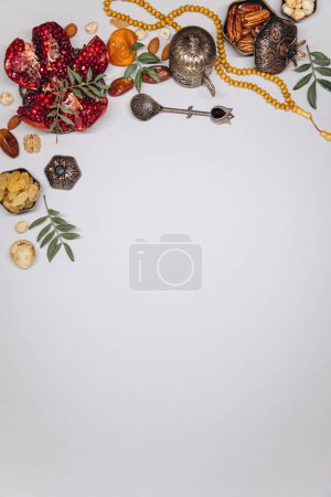 Photo for Traditional table for Ramadan. Set of dried fruits, on old islamic tableware, top view, copy space. - Royalty Free Image