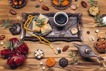 Photo for Ramadan table top view. Banner with traditional Arabic dishes, cup of coffee and food sets - Royalty Free Image