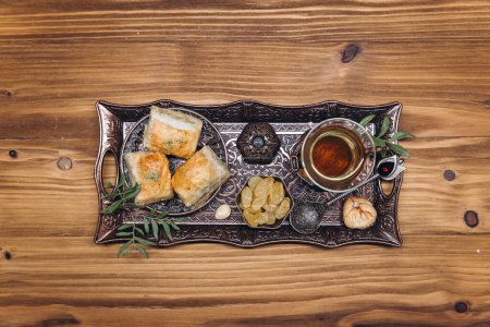 Photo for Ramadan table top view. Banner with traditional cup of tea, dishes and food sets - Royalty Free Image