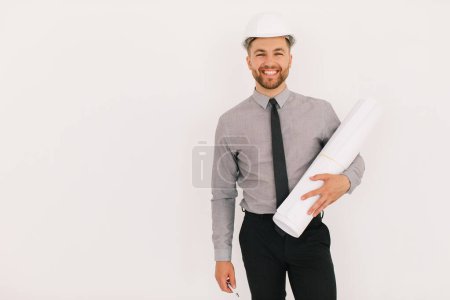 Photo for Happy male chief architect holding drawing with copy space on a white background - Royalty Free Image