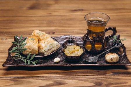 Photo for Ramadan table. Banner with traditional cup of tea, dishes and food sets - Royalty Free Image